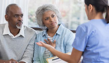 Two seniors discussing privacy information with primary care provider
